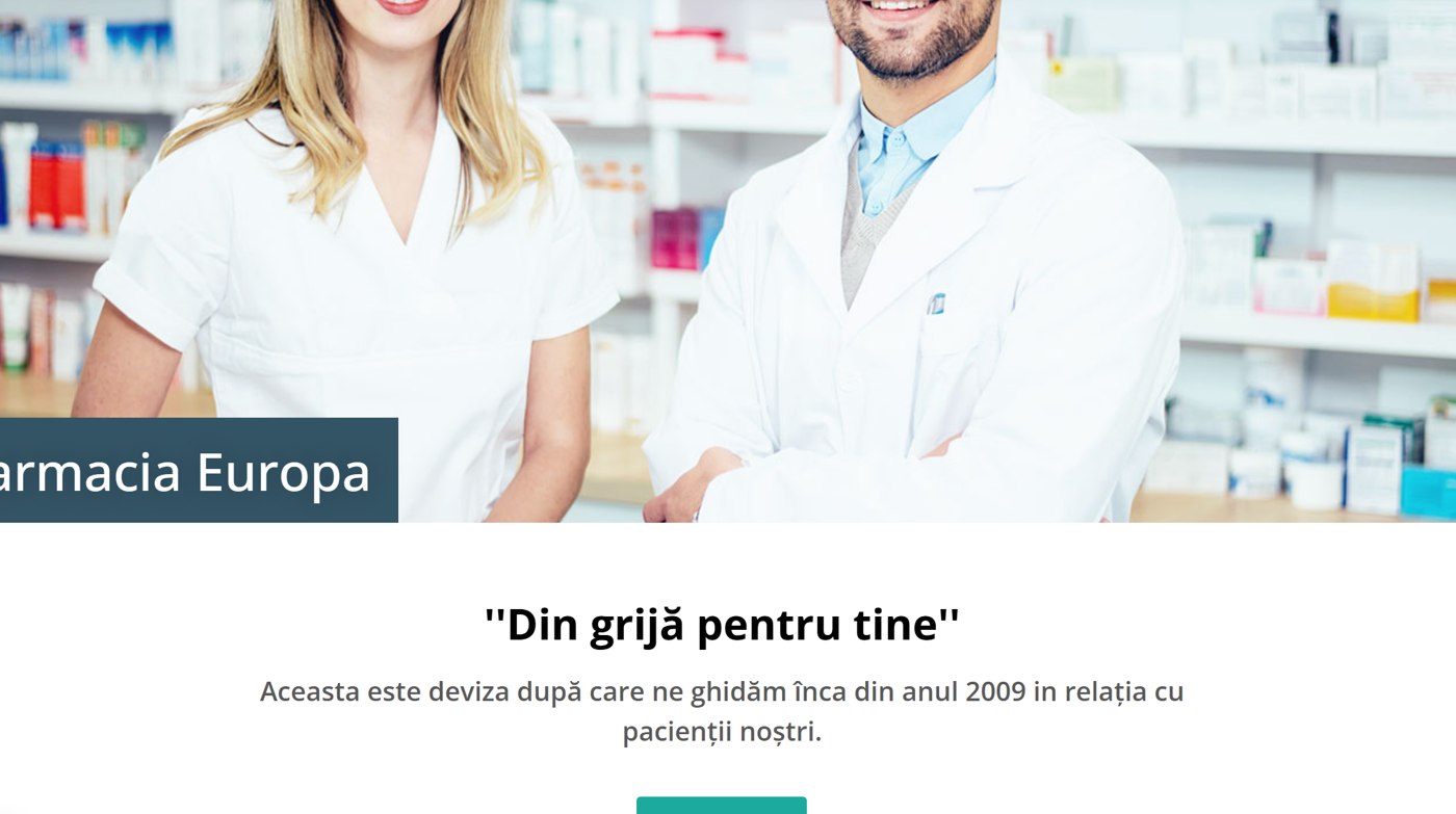 The two Farmacia Europa pharmacists smiling in front of the shelves — the faces you meet at the counter